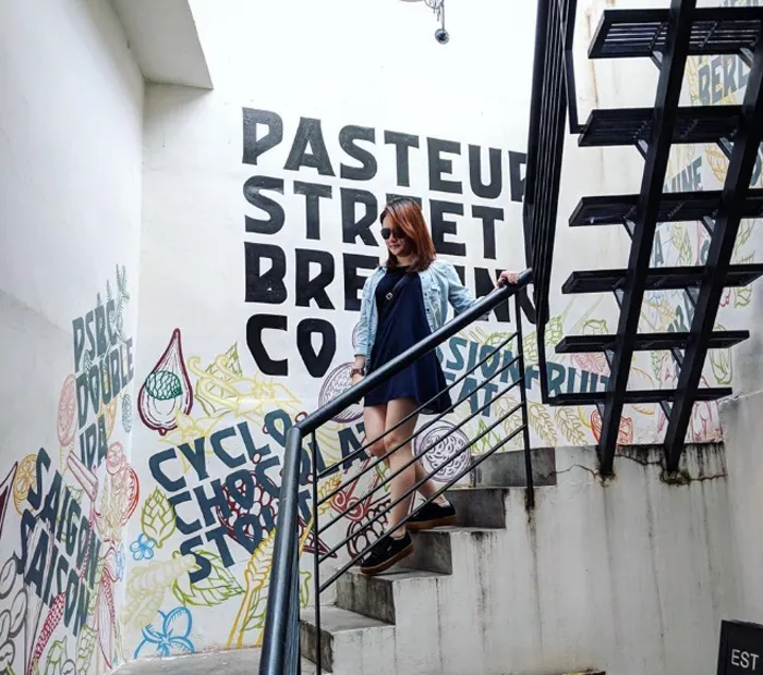 Unique entrance to a restaurant in Alley 144 Pasteur, decorated with artistic calligraphy.