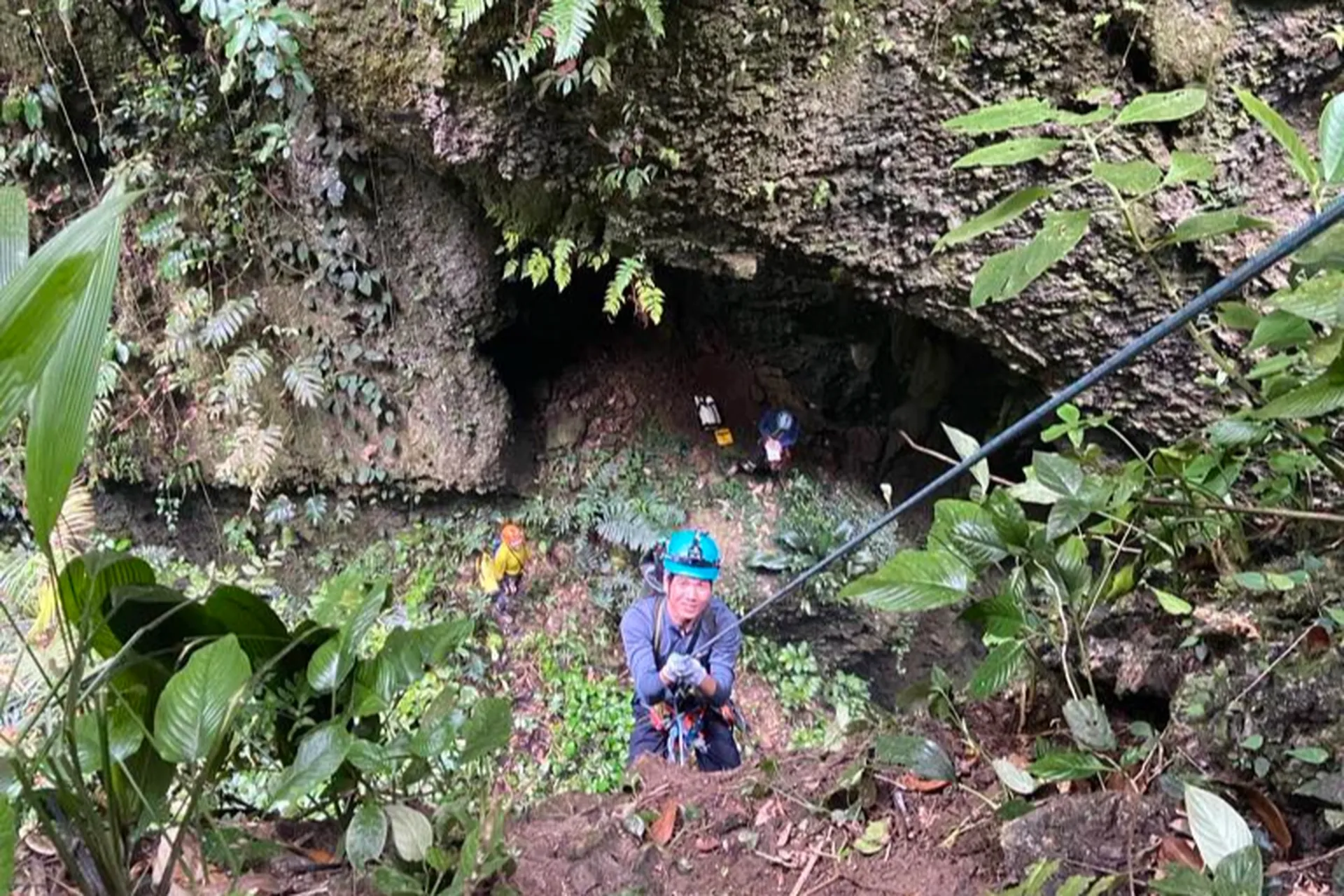 Inside a newly discovered cave, showcasing unique stalactite formations illuminated by light
