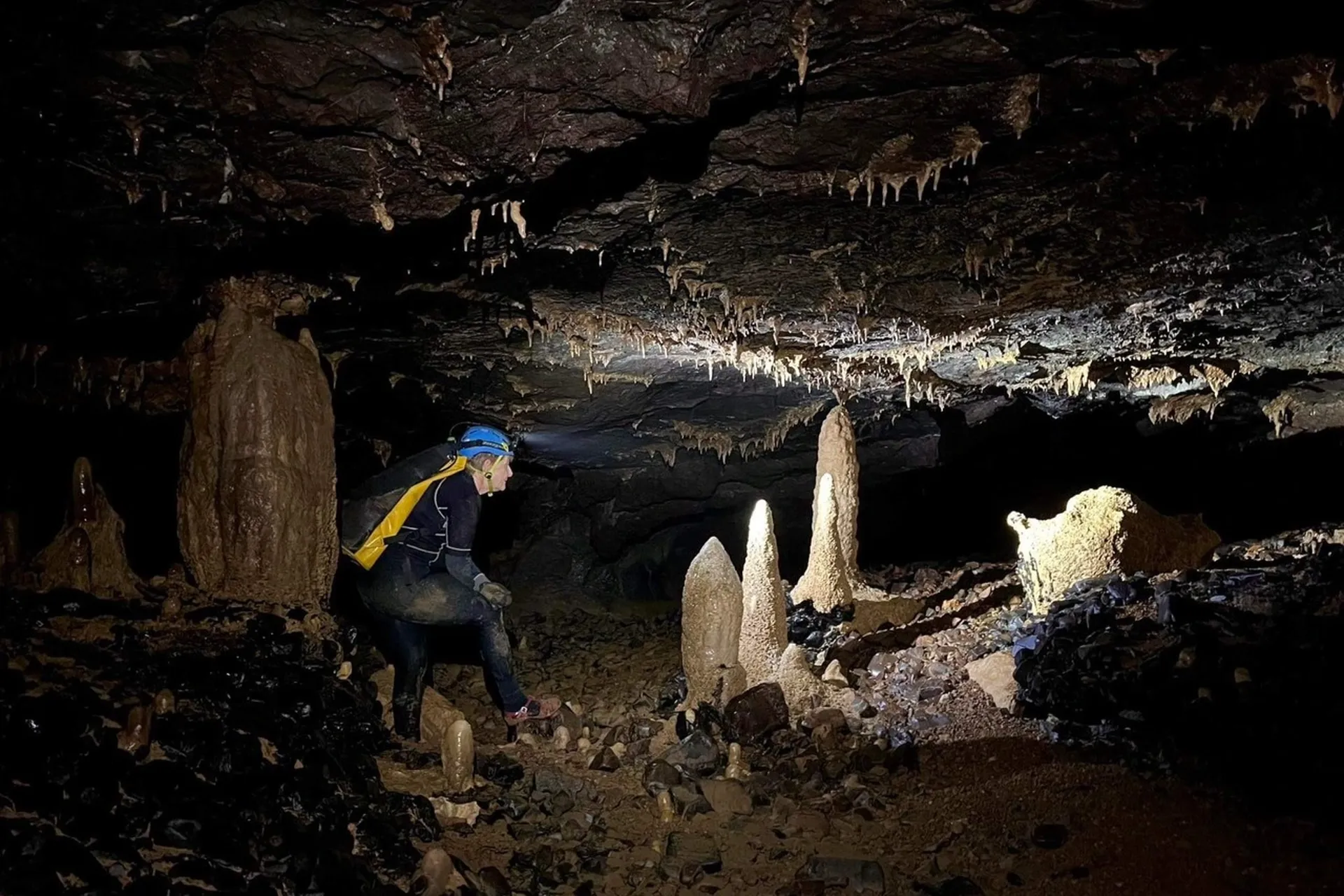 A narrow passage in a cave, requiring dexterity and caution when moving