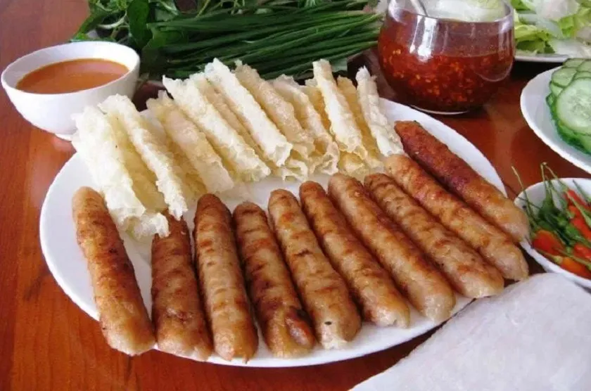 Grilled pork sausage at Ba Nam restaurant, a Nha Trang sidewalk Nem Nuong restaurant, fast service, convenient for takeout