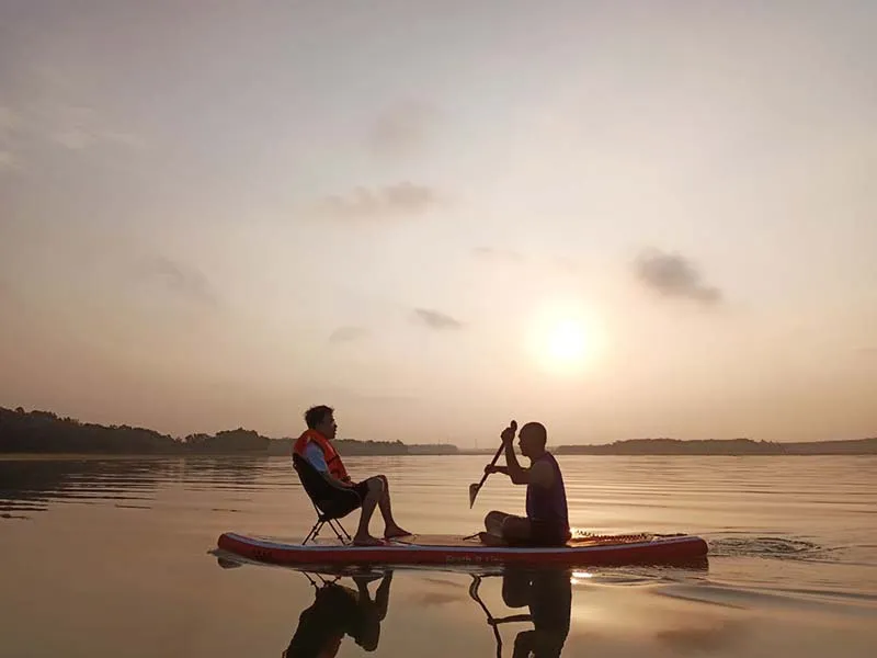 Admiring the fresh nature while SUP paddling in the middle of Dau Tieng Lake