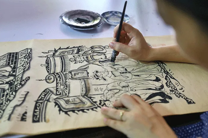 Dong Ho painting village artisan meticulously working on each stage