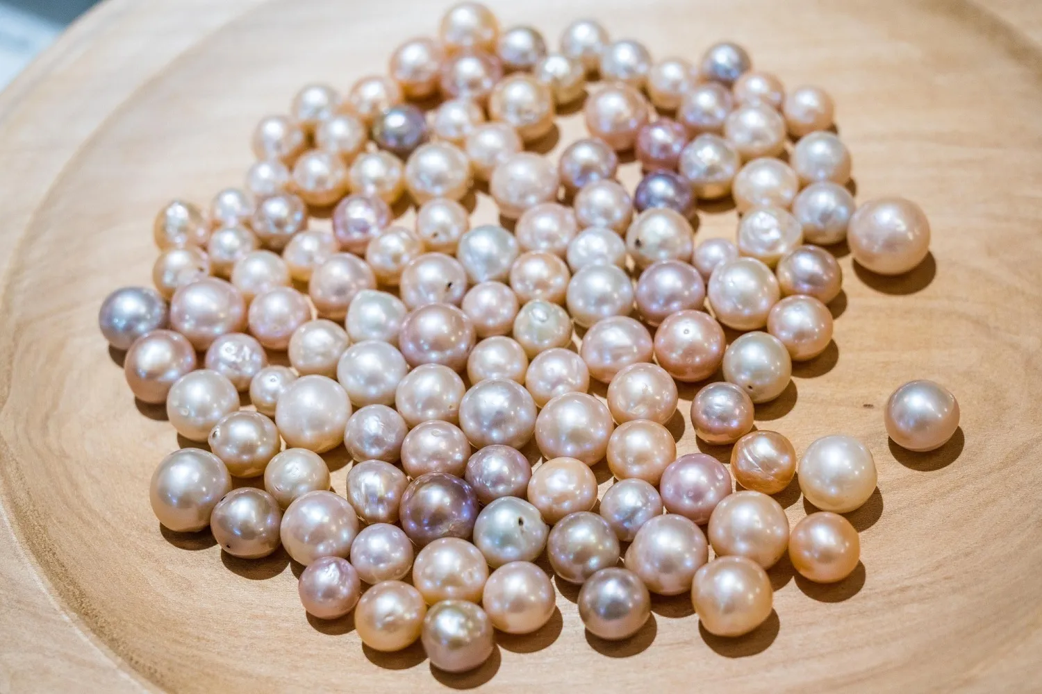 Natural pearls exhibit a soft, non-uniform luster.