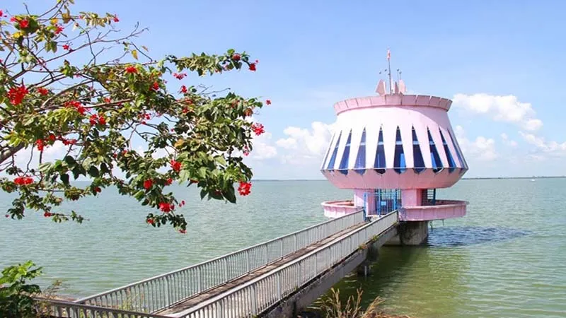 Pink lighthouse standing out in the Dau Tieng Lake scenery