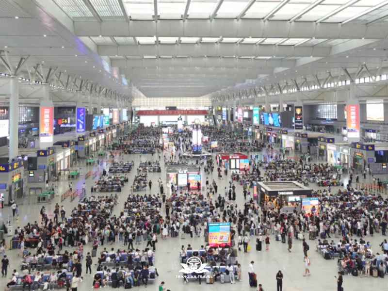 Modern high-speed train station bustling with passengers