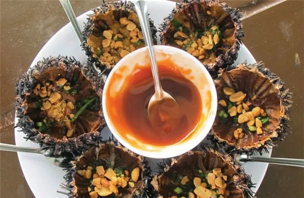 Grilled sea urchin with scallion oil - a must-try specialty
