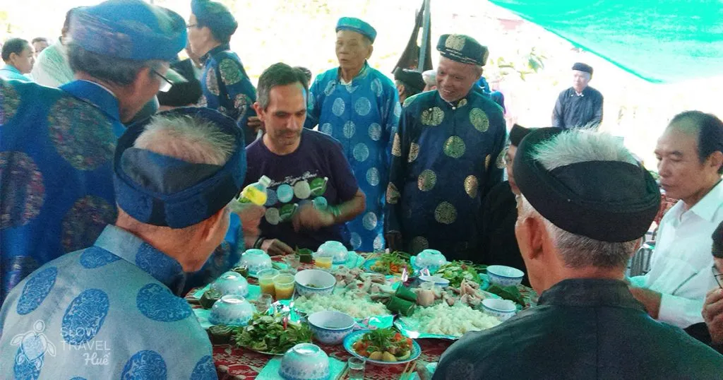 Elders inviting "slow" tourists to participate in a village communal ritual in Thuy Bieu and a death anniversary feast
