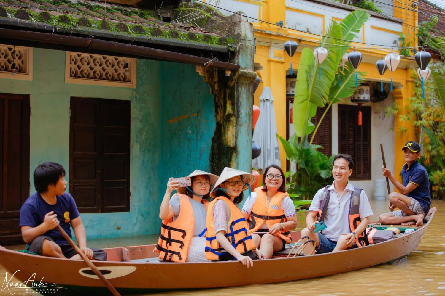 Many tourists taking boat rides to see the ancient town in floodwater