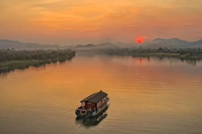 Shimmering Perfume River at night on a Hue boat tour