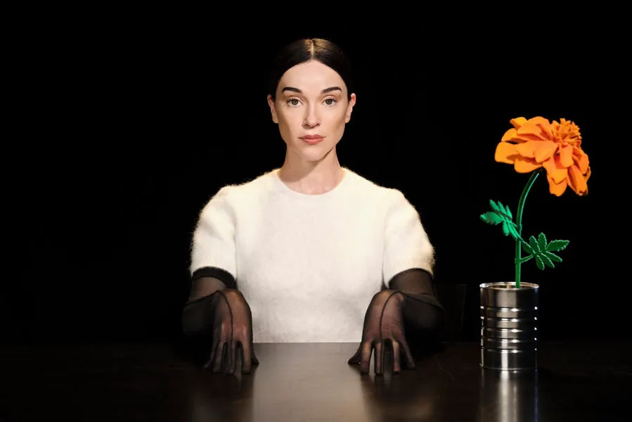St. Vincent playing guitar on stage