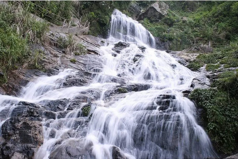 Silver Waterfall in summer with strong, white-foaming water flow