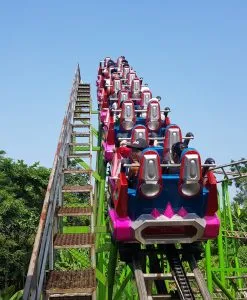 People riding thrilling rides at Nui Coc Lake
