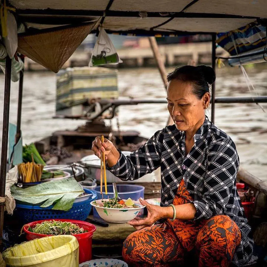 Enjoying Mekong Delta specialties at Nga Nam Floating Market in Soc Trang