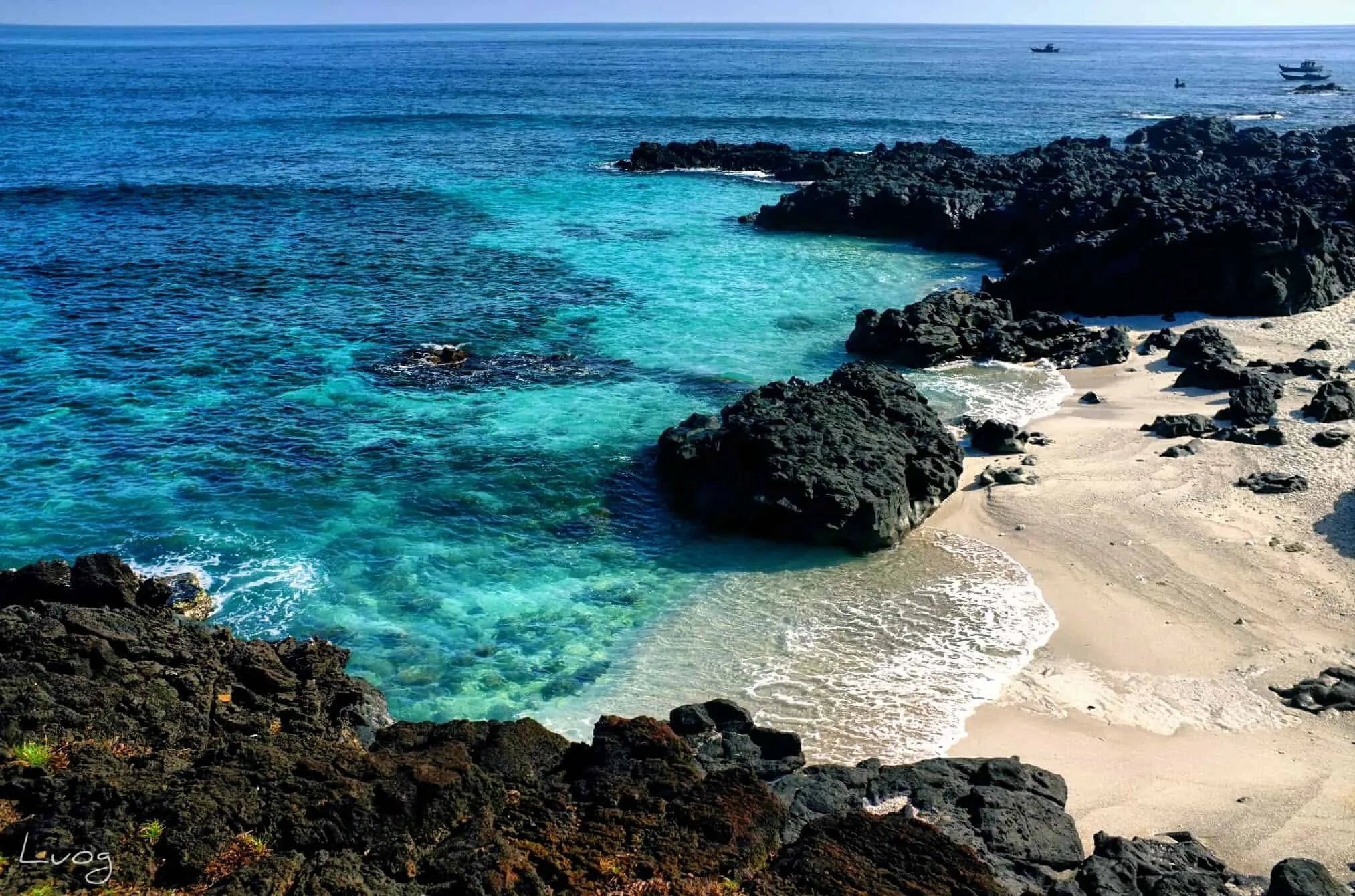 Panoramic view of Ly Son Island from above with blue sea and majestic cliffs