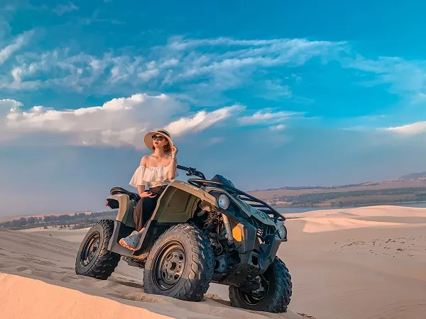 Tourists enjoying various activities at the sand dunes