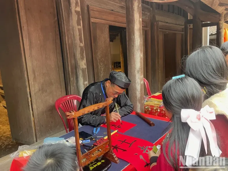 Children playing traditional Vietnamese folk games at the Vietnam Museum of Ethnology during Tet festival