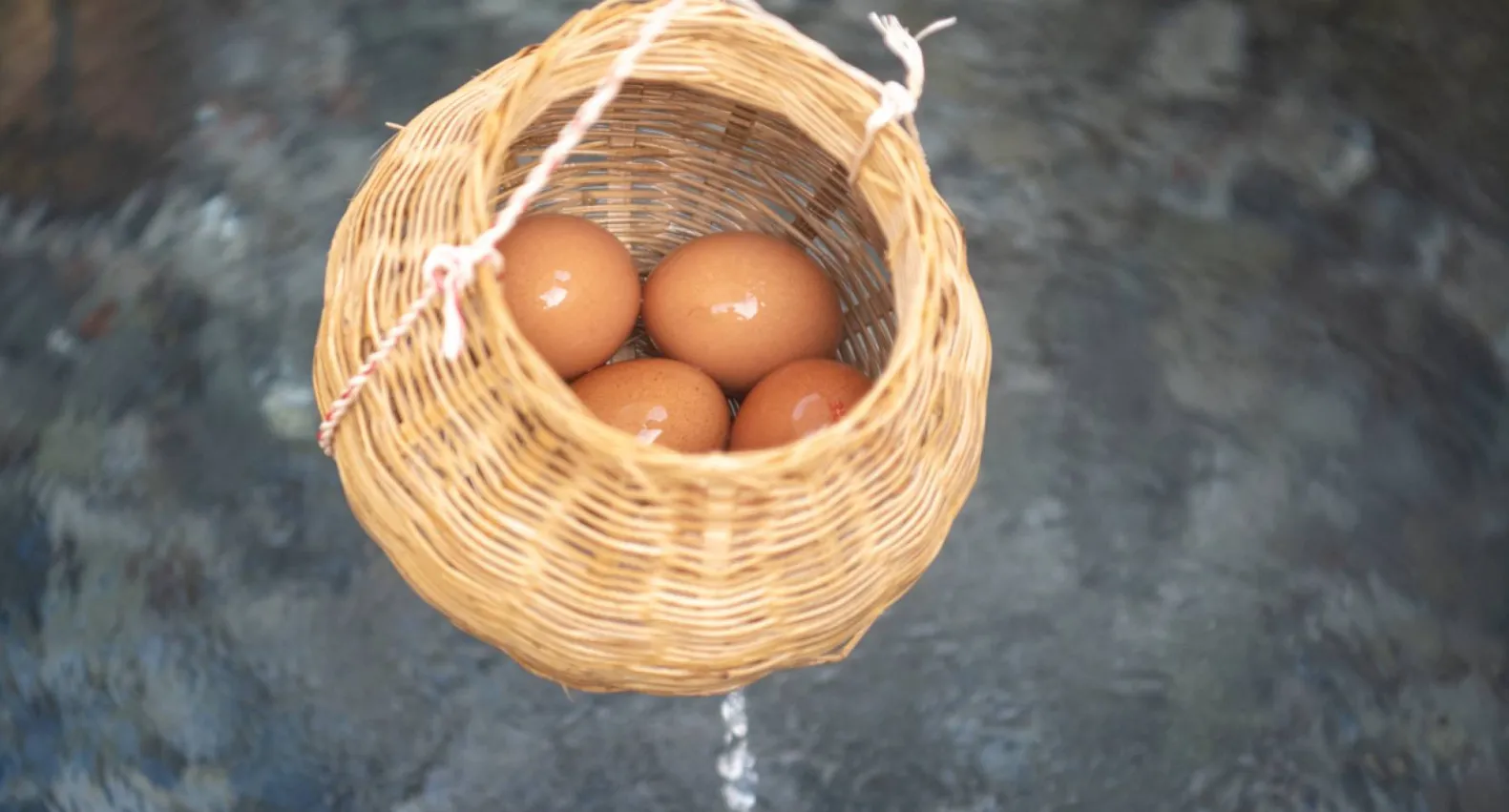 Chicken eggs being boiled with natural hot mineral water