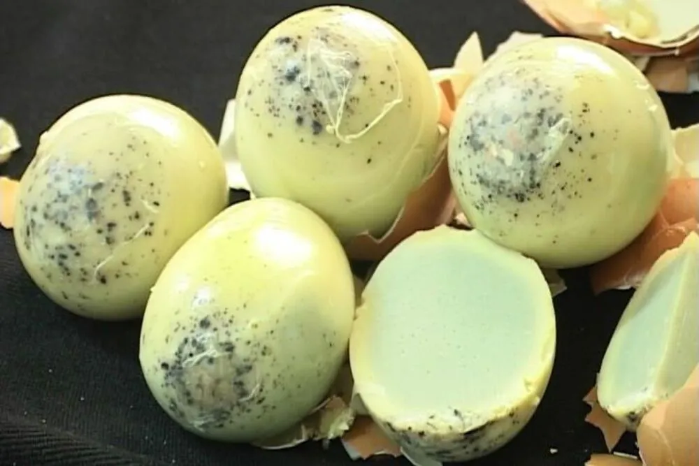 Fragrant grilled chicken eggs served with salt, pepper, and lime