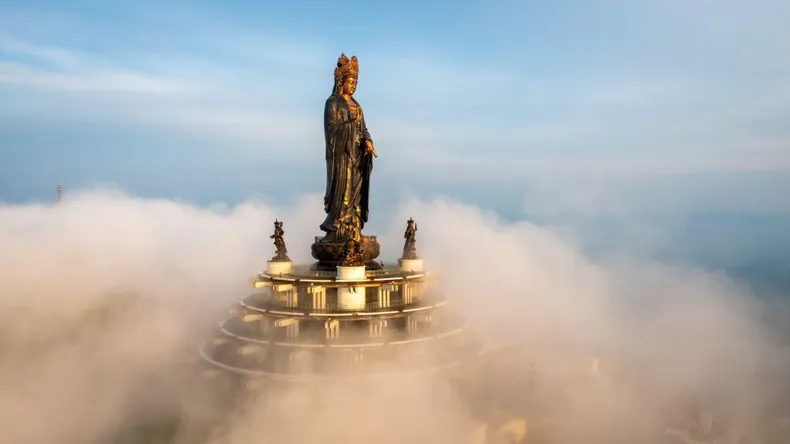 The majestic Tay Bo Da Son Buddha statue on Ba Den Mountain peak, a spiritual symbol and must-visit destination in Tay Ninh