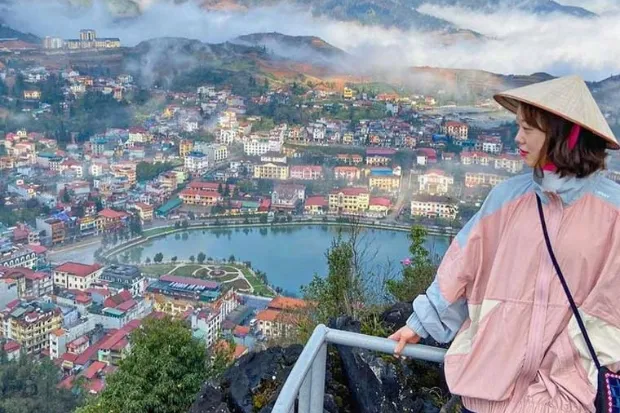 A breathtaking panoramic view of Sapa town from the summit of Ham Rong Mountain on a clear day