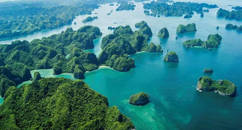 Scenic view of Bai Tu Long Bay with islands and boats